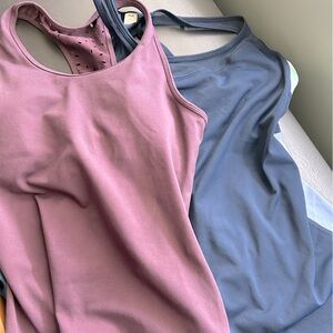 Two NWOT built in bra workout tops!